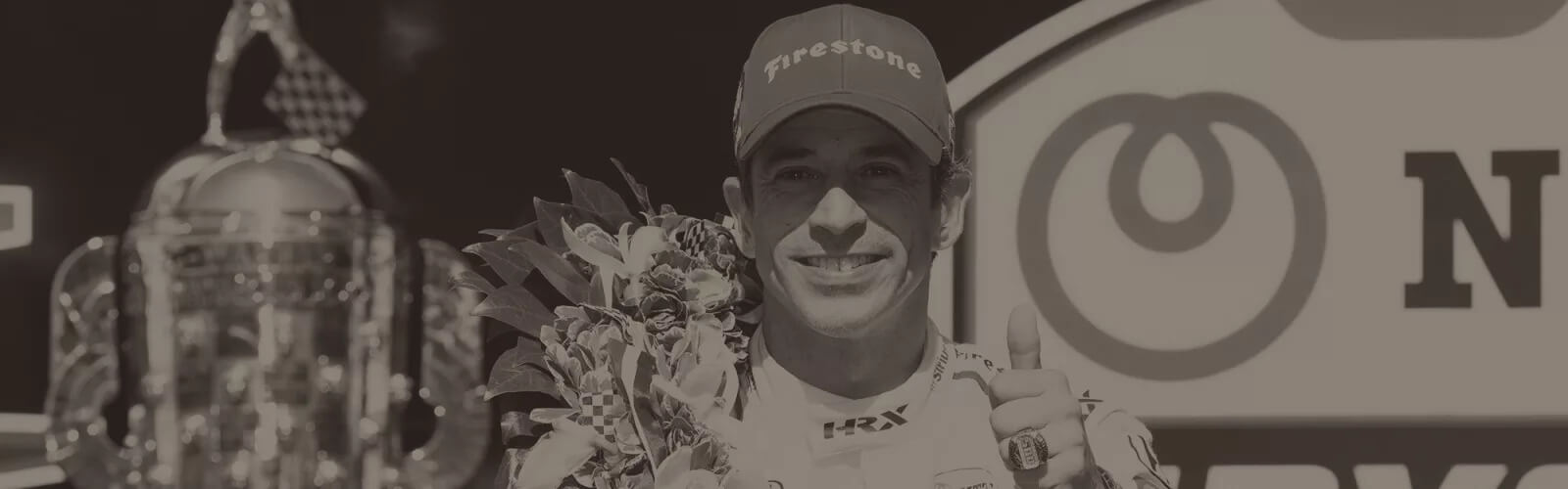 indy 500 winner, hélio castroneves, with his trophy after the race